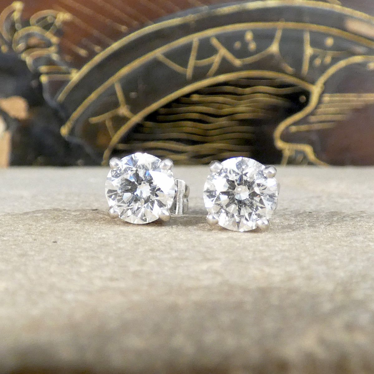 Classic and grand diamond stud earrings in platinum with high colour grade.