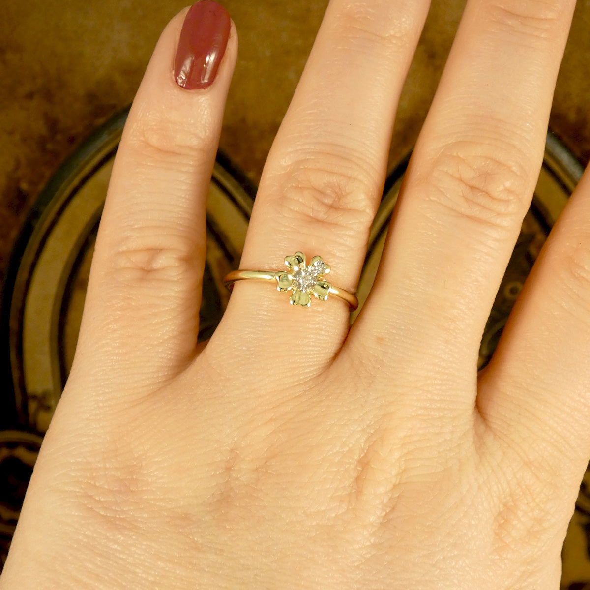 Diamond set Daisy flower ring in 9ct Yellow Gold the perfect gift. Shown when worn to see size reference and pretty aesthetic.