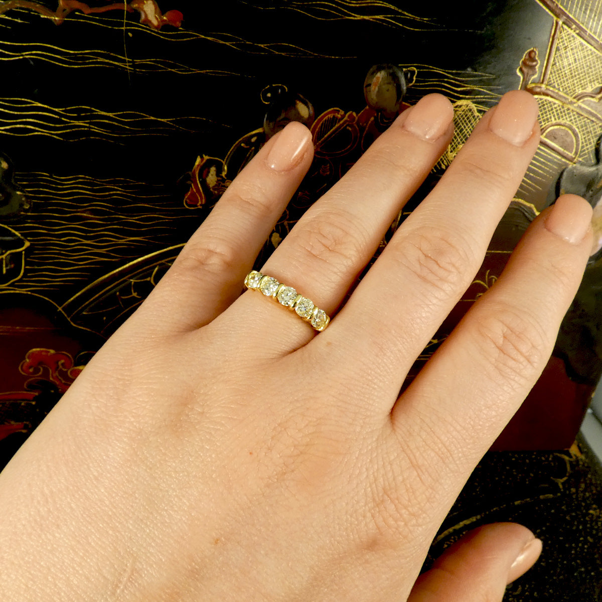 Tinted Yellow Diamond half eternity five stone ring on the hand to see the spread across the finger and how it was look sparkling in context.