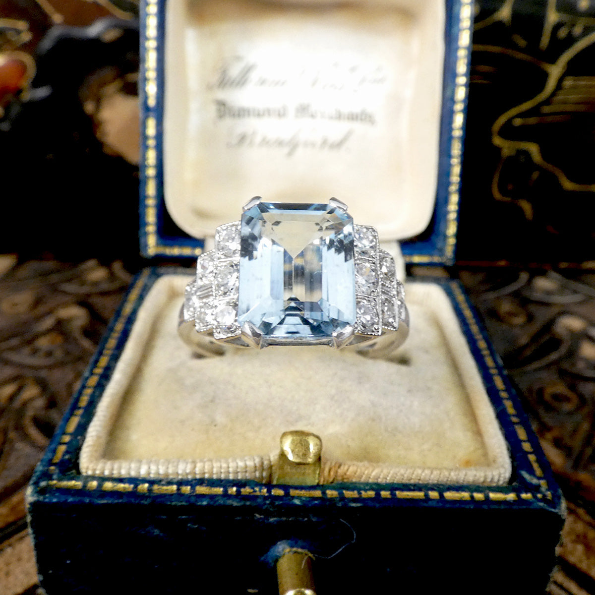 An Art Deco style ring that has been newly crafted with a 3.00ct light blue Aquamarine with graduated staged set Diamond shoulders in Platinum. Shown in vintage box, perfect vintage engagement ring.