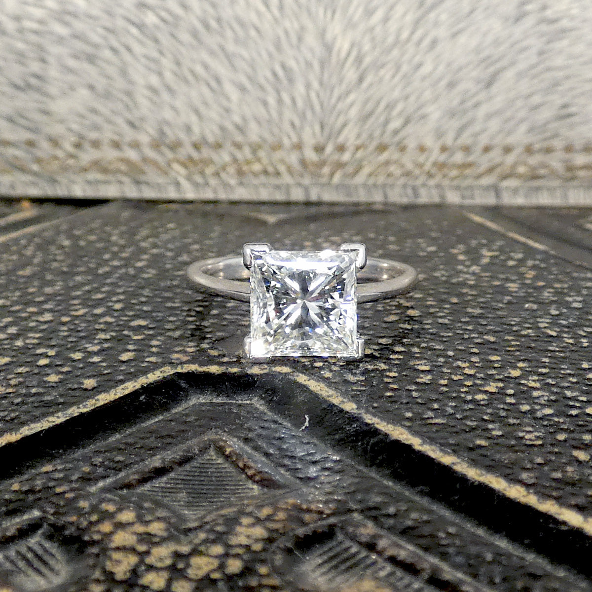 Diamond solitaire engagement ring with a Princess cut Diamond at the centre in a secure four corner claw setting.