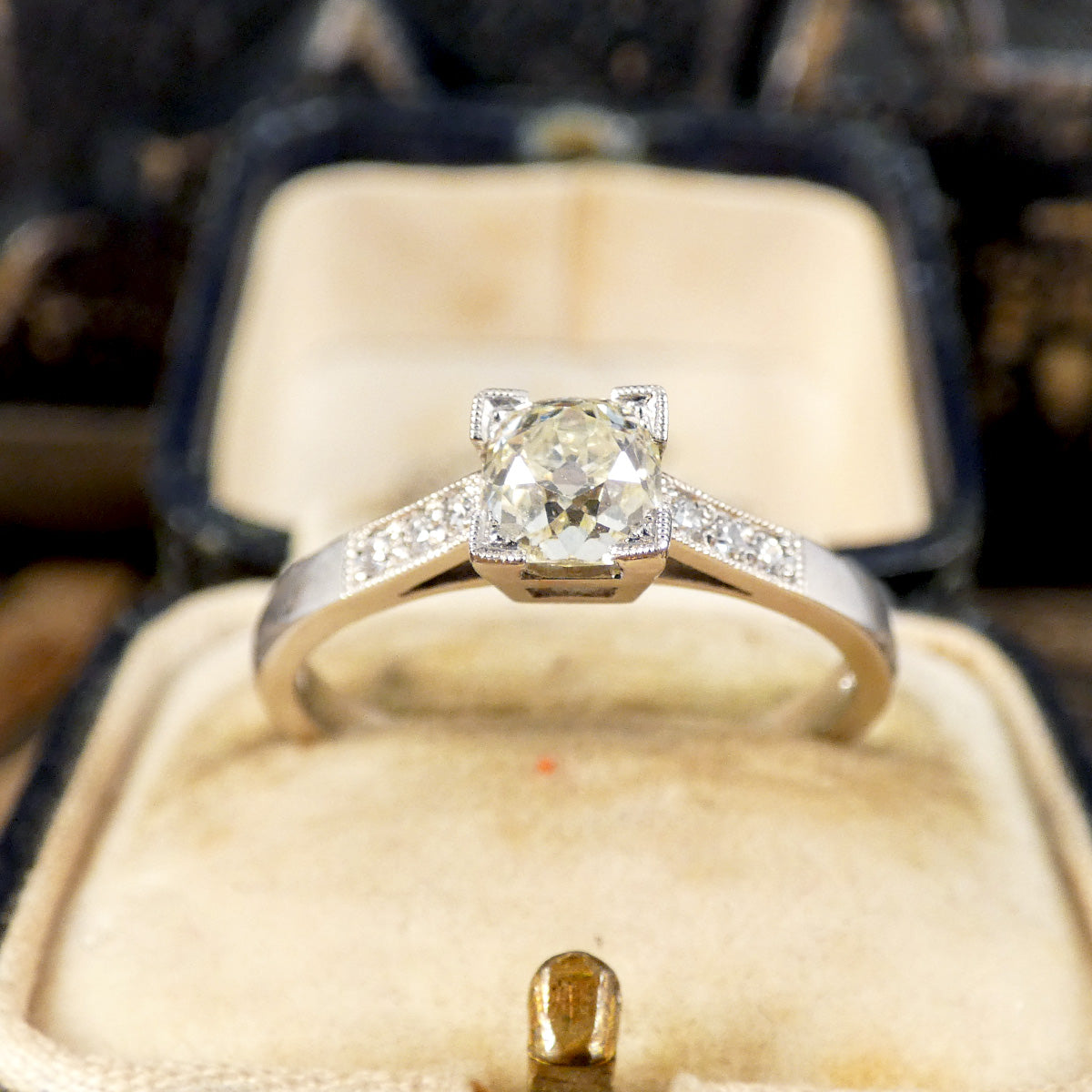 Champagne Old Cushion Cut Diamond Solitaire with Diamond set Shoulders in Platinum