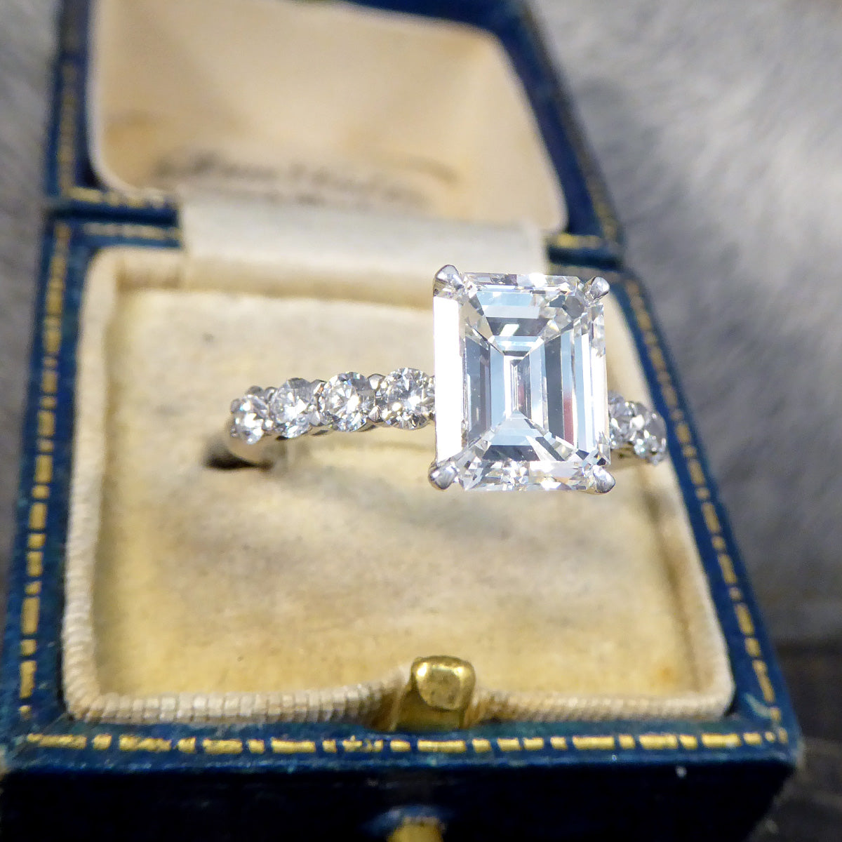 2.60ct Emerald Cut Diamond Solitaire Ring with 0.60ct Diamond Shoulders in Platinum