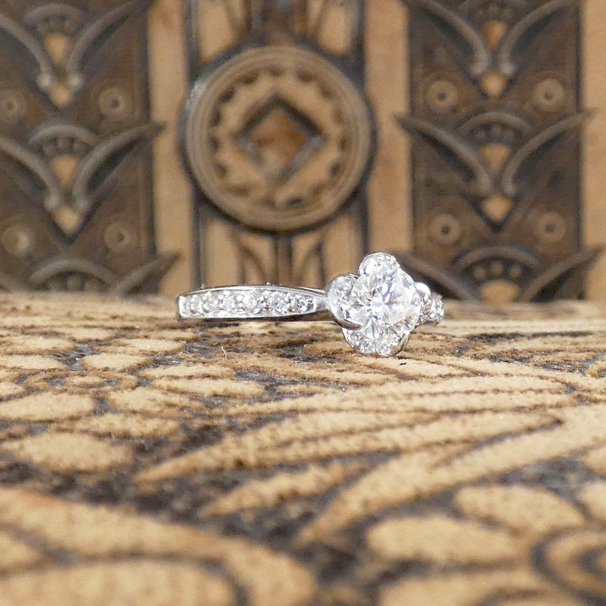 Enchanting Diamond Engagement Ring with Diamond Set twisted Detail Setting and Shoulders in 18ct White Gold.