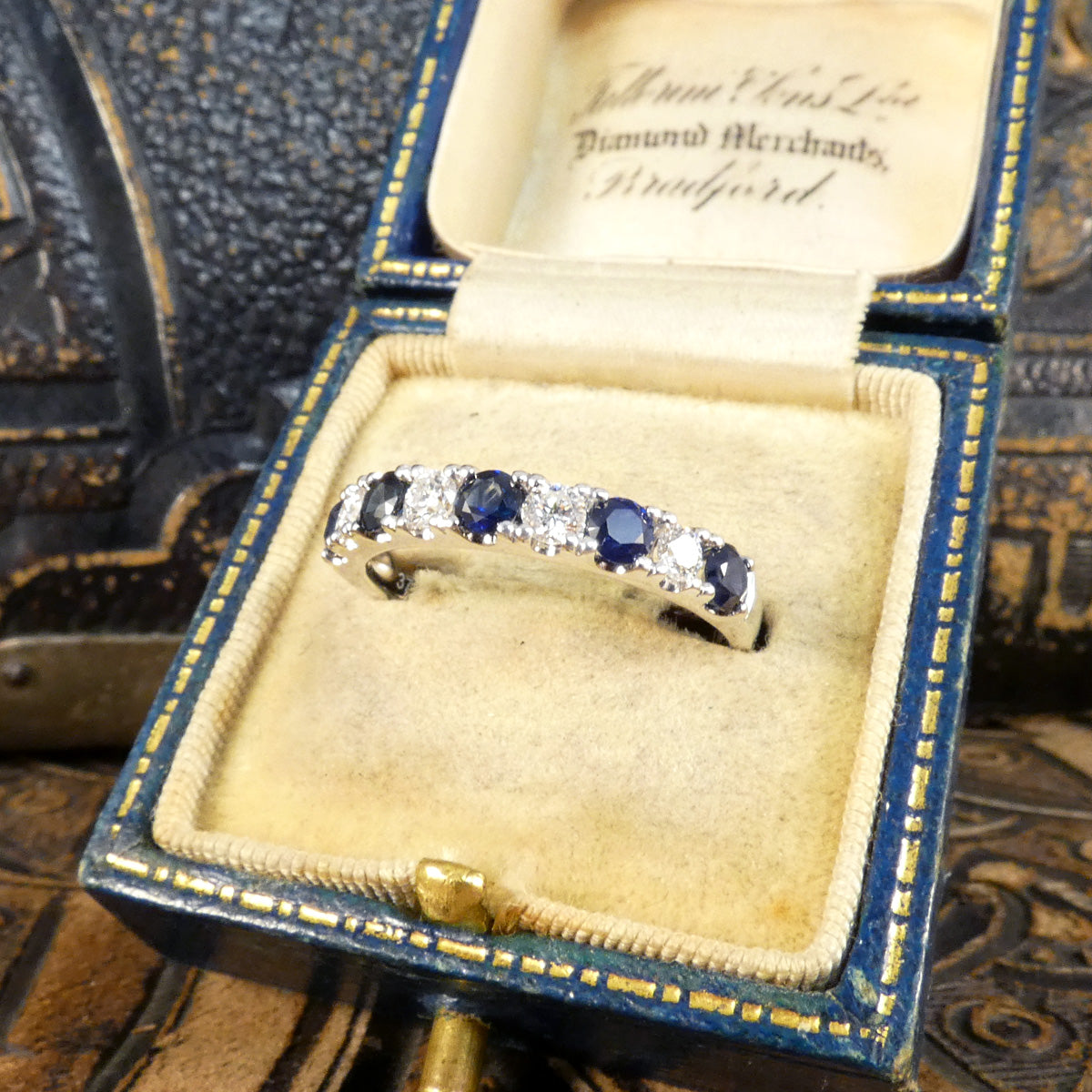 Alternating blue Sapphire and Diamond half eternity ring in white gold to complement the stones. Displayed in vintage box and would make the perfect gift.