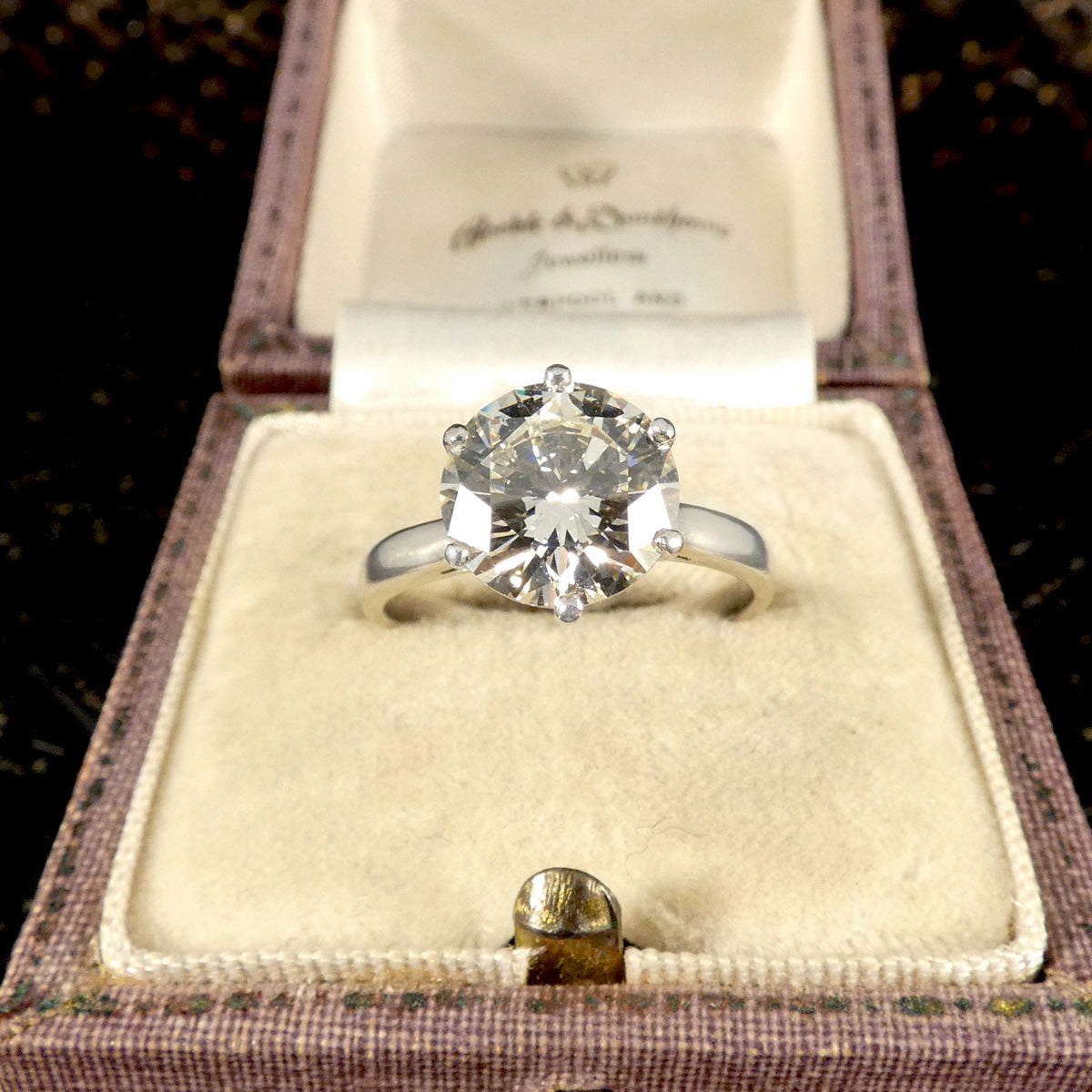 3.04ct Brilliant Cut Diamond solitaire engagement ring displayed in a vintage presentation box, showcasing its exceptional cut and clarity.