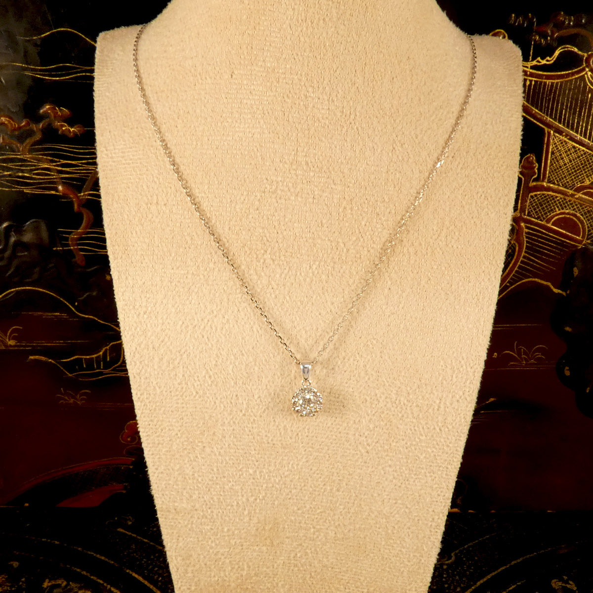 Diamond Solitaire Illusion cluster pendant necklace in 9ct White Gold. Created to look like a single stone with immense sparkle on a 9ct white gold diamond cut chain. Displayed on bust.