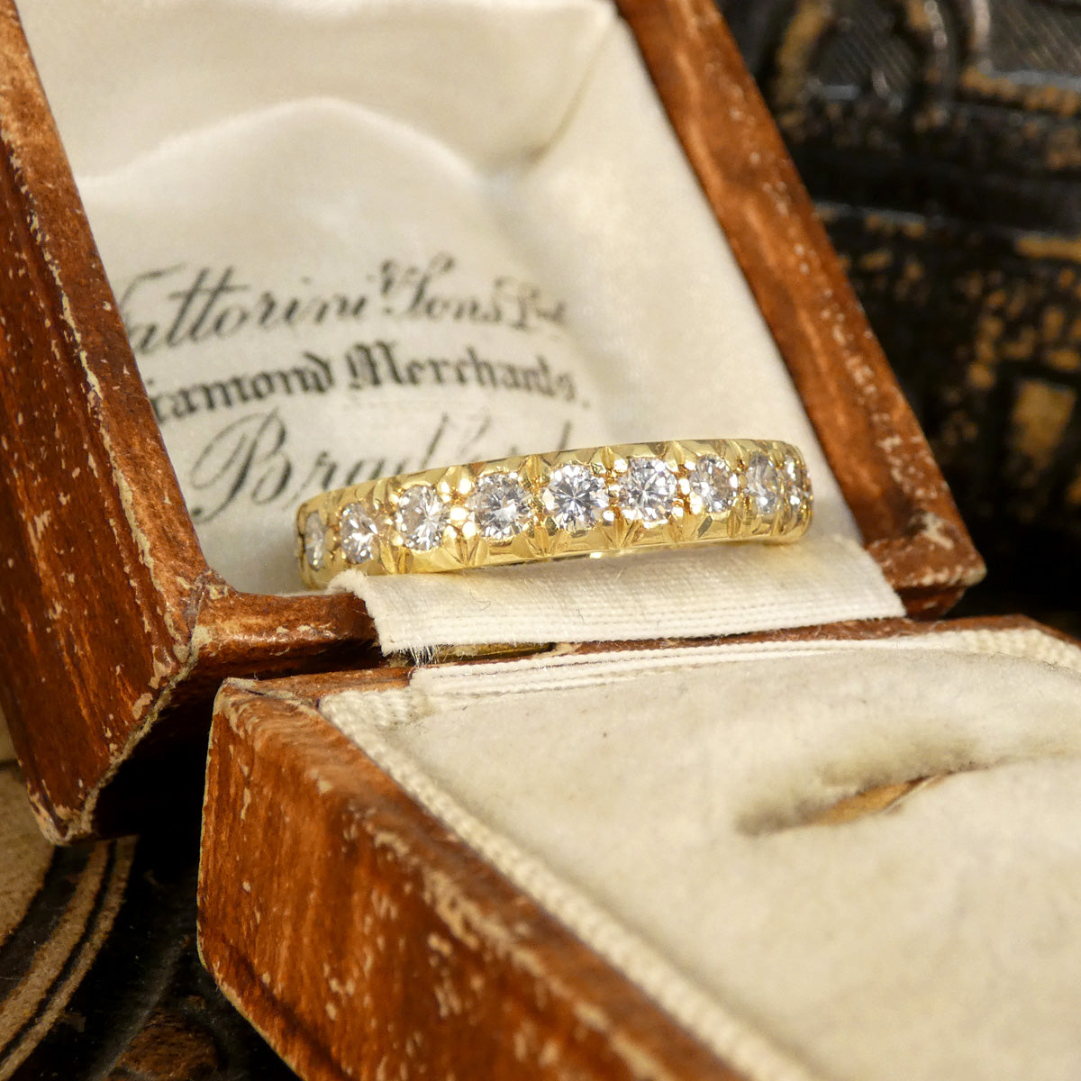 Full eternity band crafted in 18ct yellow gold, featuring bright and clear diamonds totalling 1.33ct set around the entire band with intricate detailing.