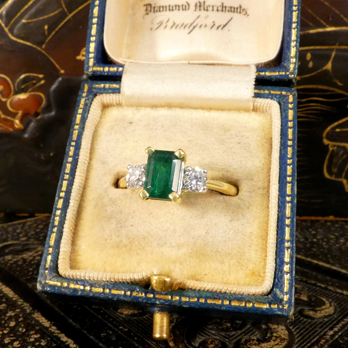 Edwardian style classic Emerald Cut Emerald and Old Cut Diamond three stone ring in 18ct Yellow and White Gold. Shown in vintage box.