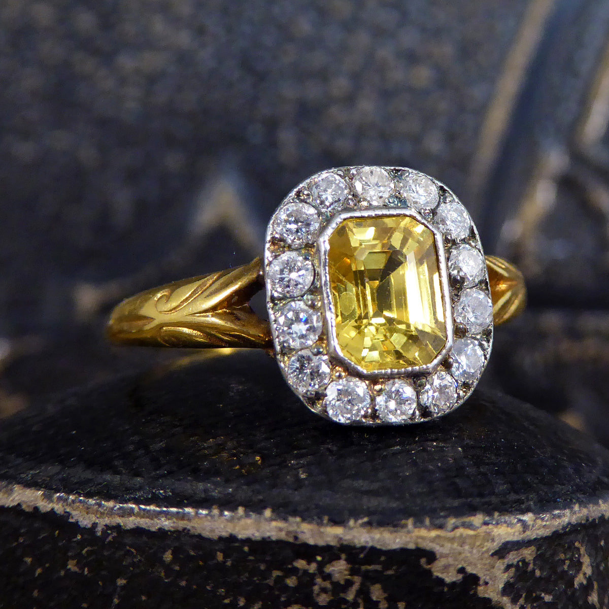 A bright and vibrant Yellow colour shining through the Georgian style cluster ring, with beautiful detail in the shoulders with a split design.