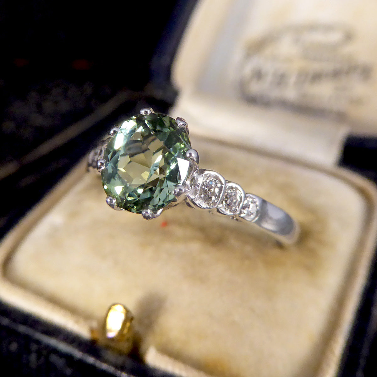 Enchanting Green Tourmaline Ring with Diamond Shoulders in 18ct White Gold