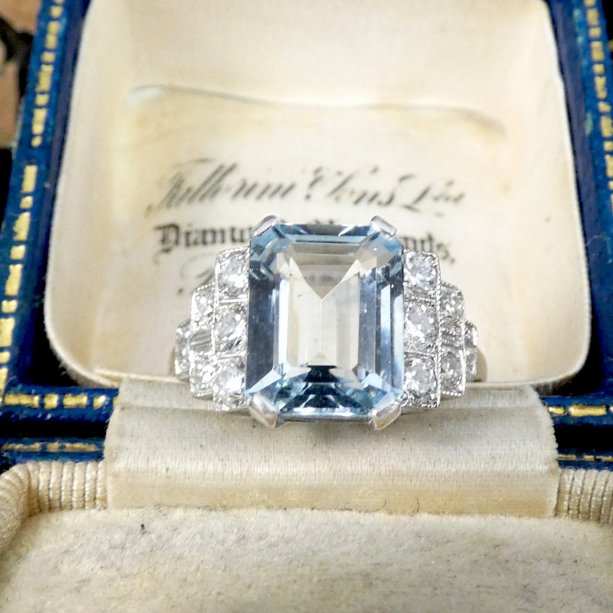 An Art Deco style ring that has been newly crafted with a 3.00ct light blue Aquamarine with graduated staged set Diamond shoulders in Platinum.