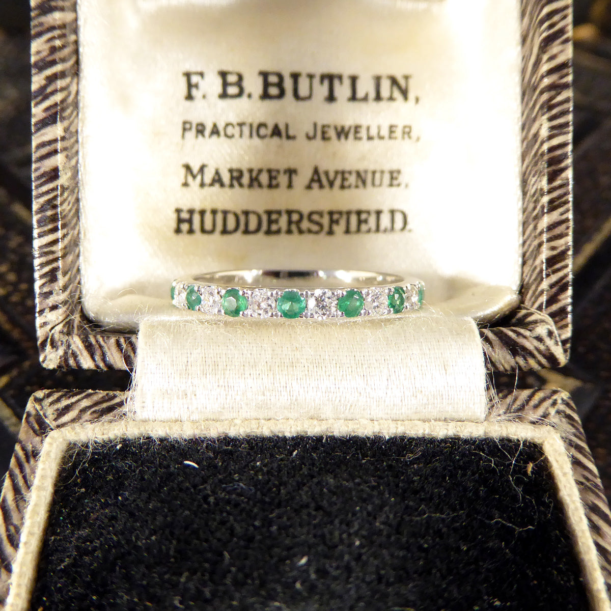 Emerald and Diamond Half Eternity Ring in White Gold