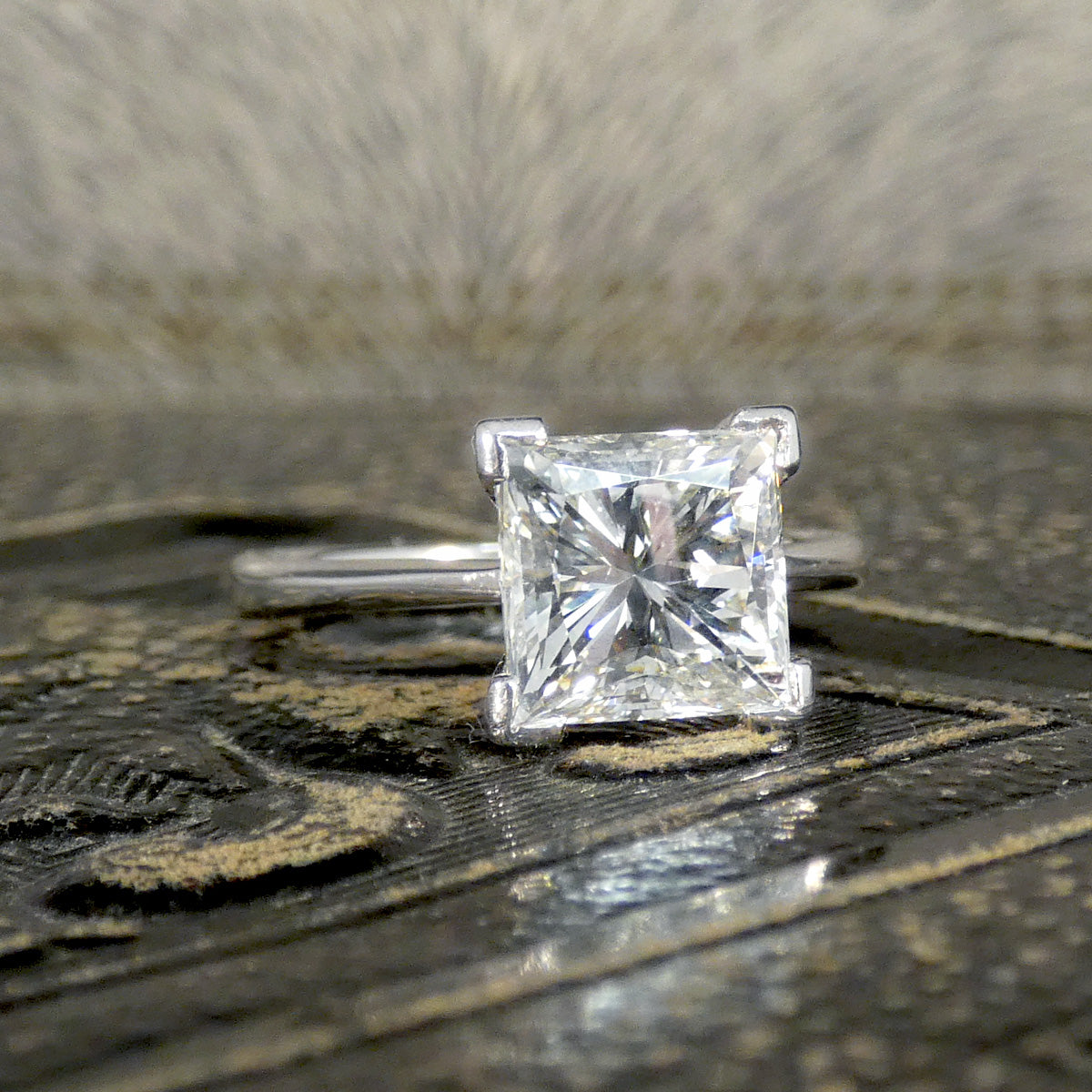 Second hand and pre-loved princess cut diamond engagement ring with extra sparkle throughout.