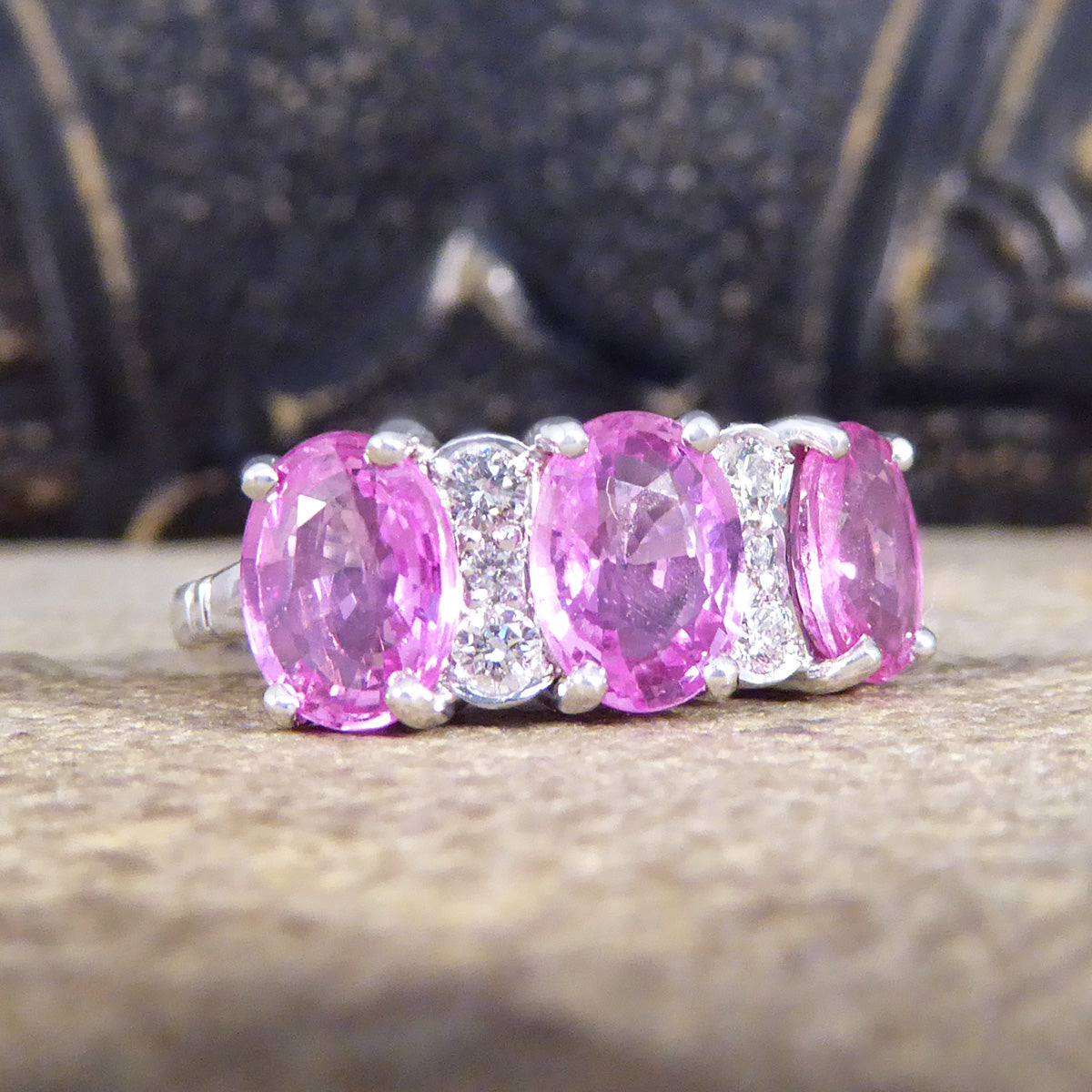 Pink Sapphire Three Stone Ring with Diamond Spacers in 18ct White Gold