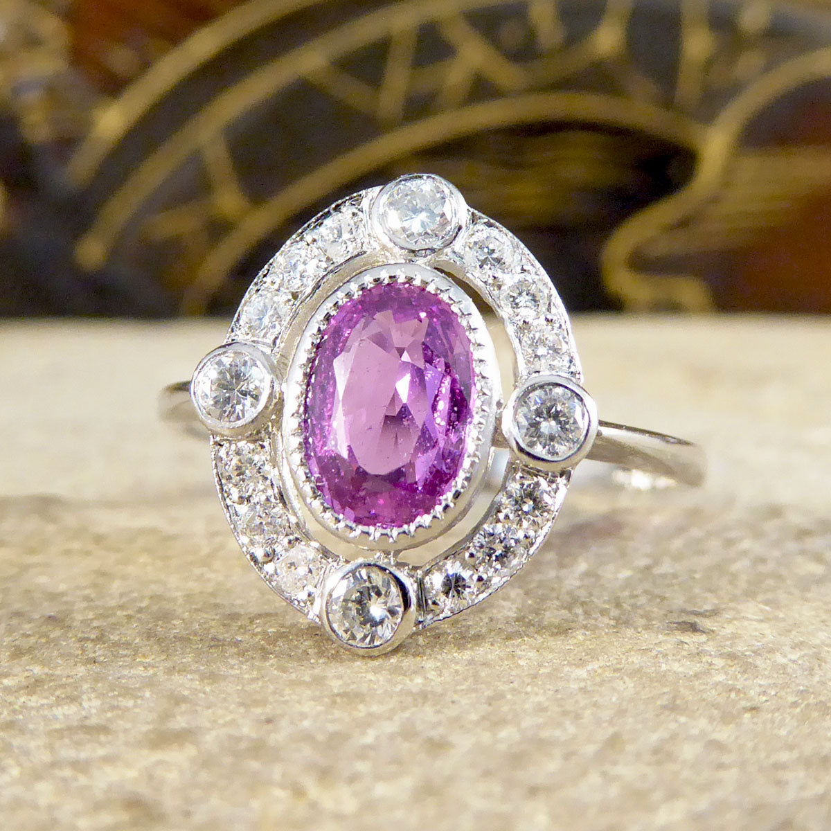 Contemporary 1.05ct Pink Sapphire and Diamond Halo Ring Mounted in Platinum