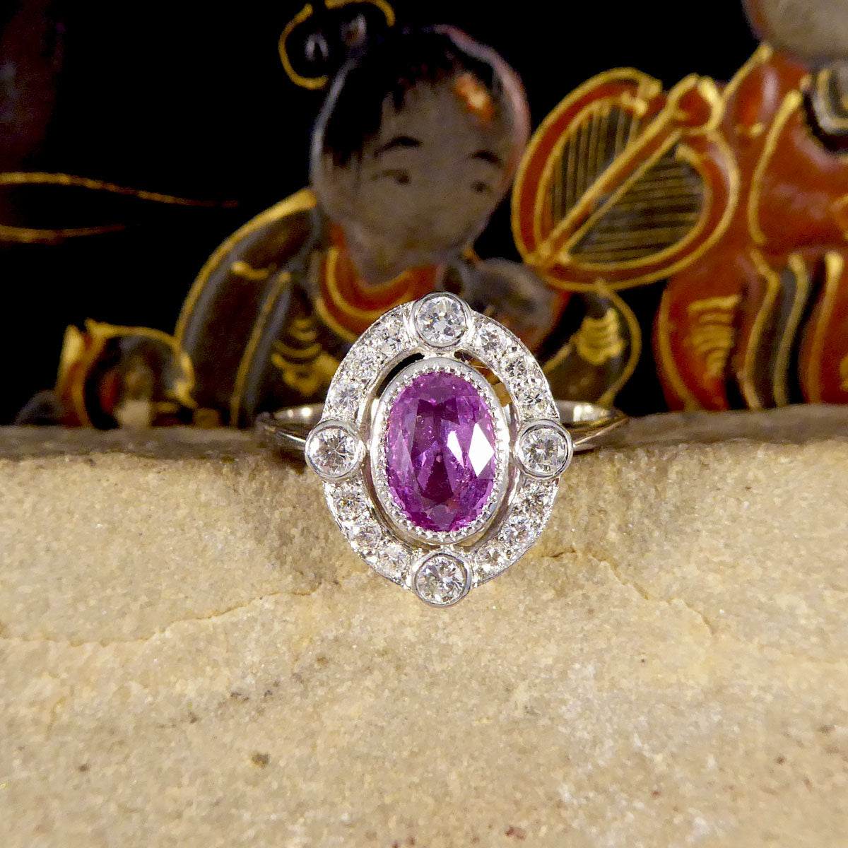 Contemporary 1.05ct Pink Sapphire and Diamond Halo Ring Mounted in Platinum