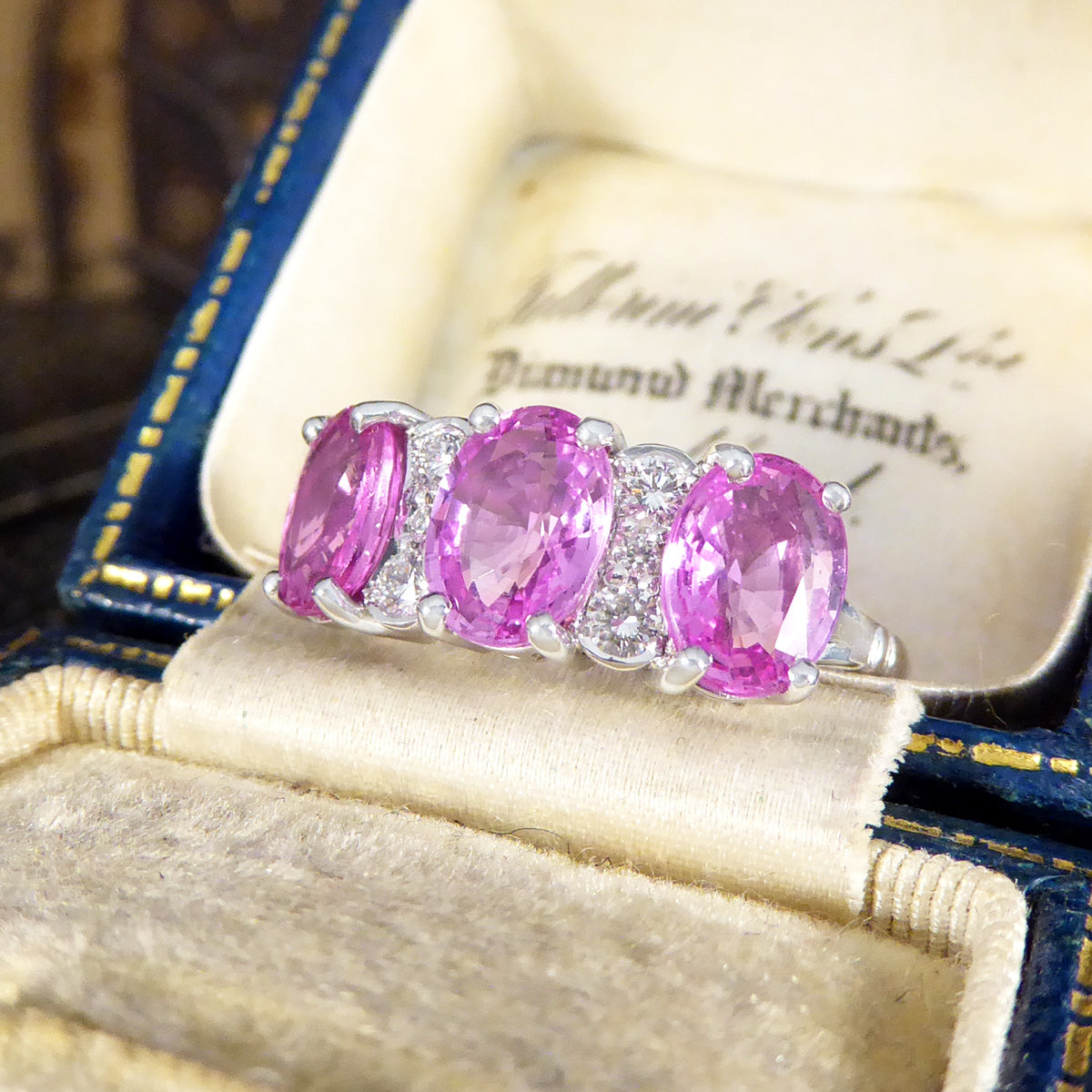 Pink Sapphire Three Stone Ring with Diamond Spacers in 18ct White Gold